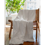 Load image into Gallery viewer, A white cotton duvet cover on a chair in front of a green plant inside a living room [44422681886939, 45027099410651]
