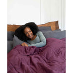 Load image into Gallery viewer, A smiling woman leans across a bed with a weighted blanket wrapped around her. [44405994029275, 45574417907931]
