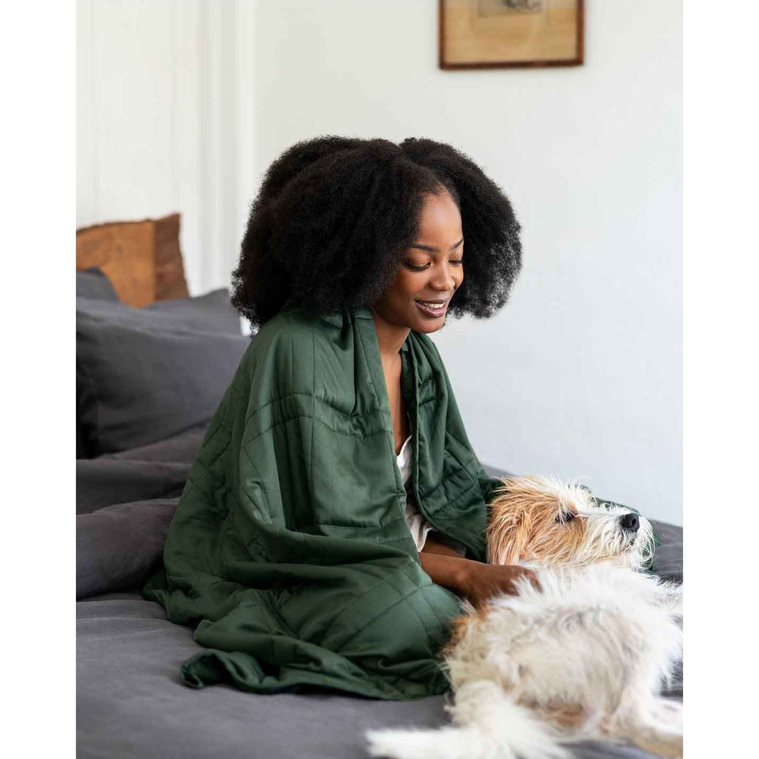 A woman sits in bed petting a dog [46061921730779, 46301205299419, 46061921763547, 46301205332187, 46061921796315, 46301205364955, 46063267709147, 46301205266651, 46063269118171]