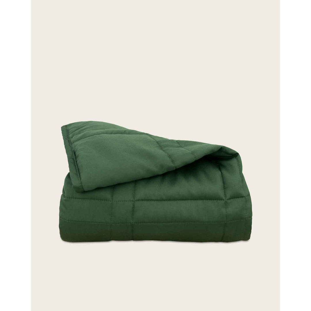 folded weighted blanket in spruce green against an empty background [44422820561115, 44422814826715, 44422813090011, 44422818234587, 45574418333915, 45574418235611, 45574418202843, 45574418235611, 45574418202843, 45574418301147]