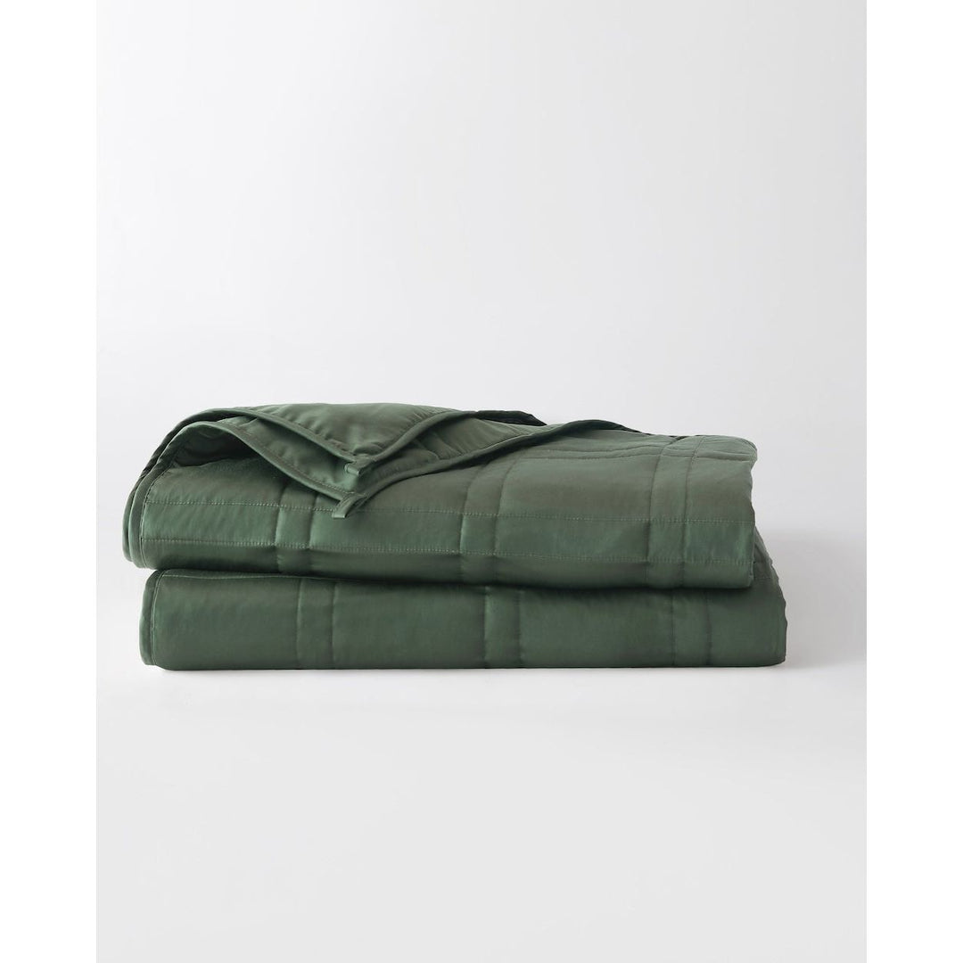 folded weighted blanket in spruce green against an empty background [44422820561115, 44422814826715, 44422813090011, 44422818234587,46061921730779, 46061921763547, 46061921796315, 46063267709147, 46063269118171]