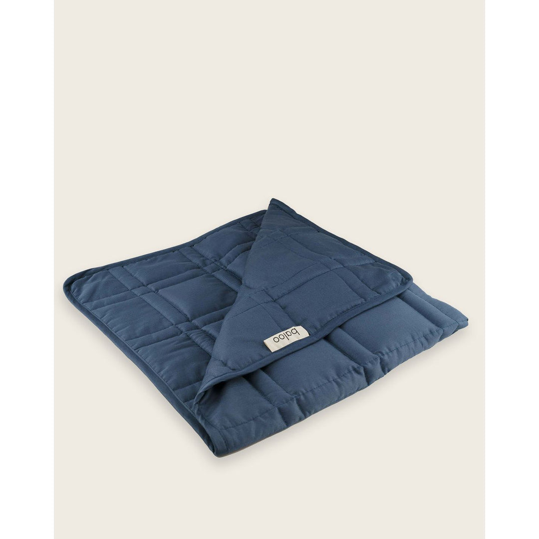 A folded lap blanket in luna blue [43936127254747]