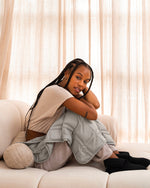 Load image into Gallery viewer, A young woman with braids sits on a beige sofa in loungwear, with a silver sage lap blanket on her lap. [43580656746715, 46288037413083,46730821042395, 46730821075163, 46730821107931, 46730821140699]
