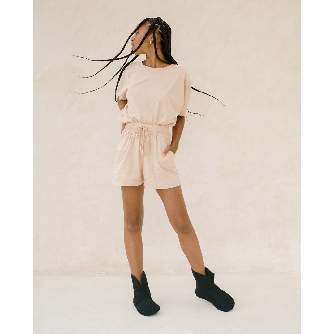 A woman stands up wearing cloud booties in black [43579501215963, 43579501248731, 43579501281499, 43579501314267]