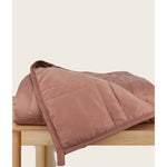 Load image into Gallery viewer, [44676999741659] Hope Rose weighted blanket folded on a table
