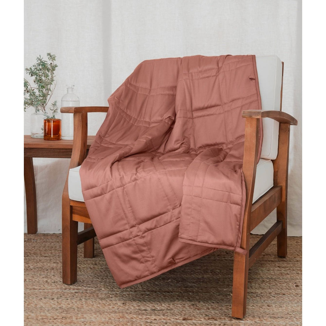 [44676999741659] a Hope Rose weighted blanket on a chair 