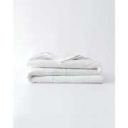 Folded white cotton comforter. [32783560769616, 32783560802384, 32783560933456]