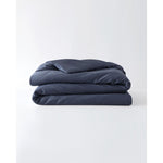 Load image into Gallery viewer, A folded cotton duvet cover in Luna Blue on a blank background [44422682083547, 45027100033243,46061921763547, 46301205332187, 46063268331739, 46301204938971, 46061921632475, 46061921501403, 46301205201115, 46061921370331, 46301205070043]
