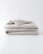Load image into Gallery viewer, A silver sage cotton duvet cover folded against an empty background [44422682050779, 45027099771099, 46061921337563, 46301205037275, 46061921468635, 46301205168347, 46061921599707, 46061921730779, 46301205299419, 46063268298971, 46301204906203, 46730786635995, 46730786898139, 46730787160283, 46730787422427]
