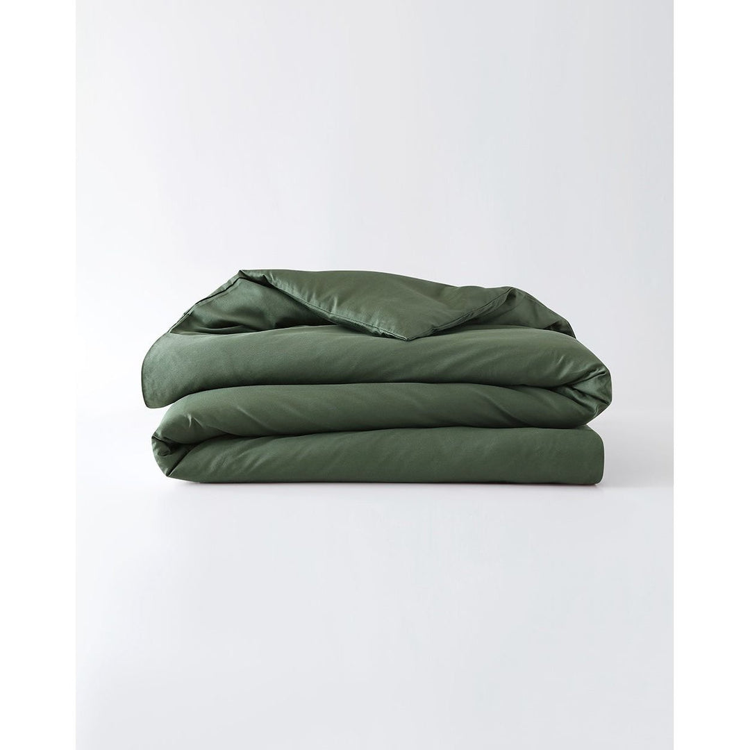 A folded cotton duvet cover in spruce against a plain background [44422682116315,46063268364507, 46061921796315, 46061921665243, 46061921534171, 46061921403099]