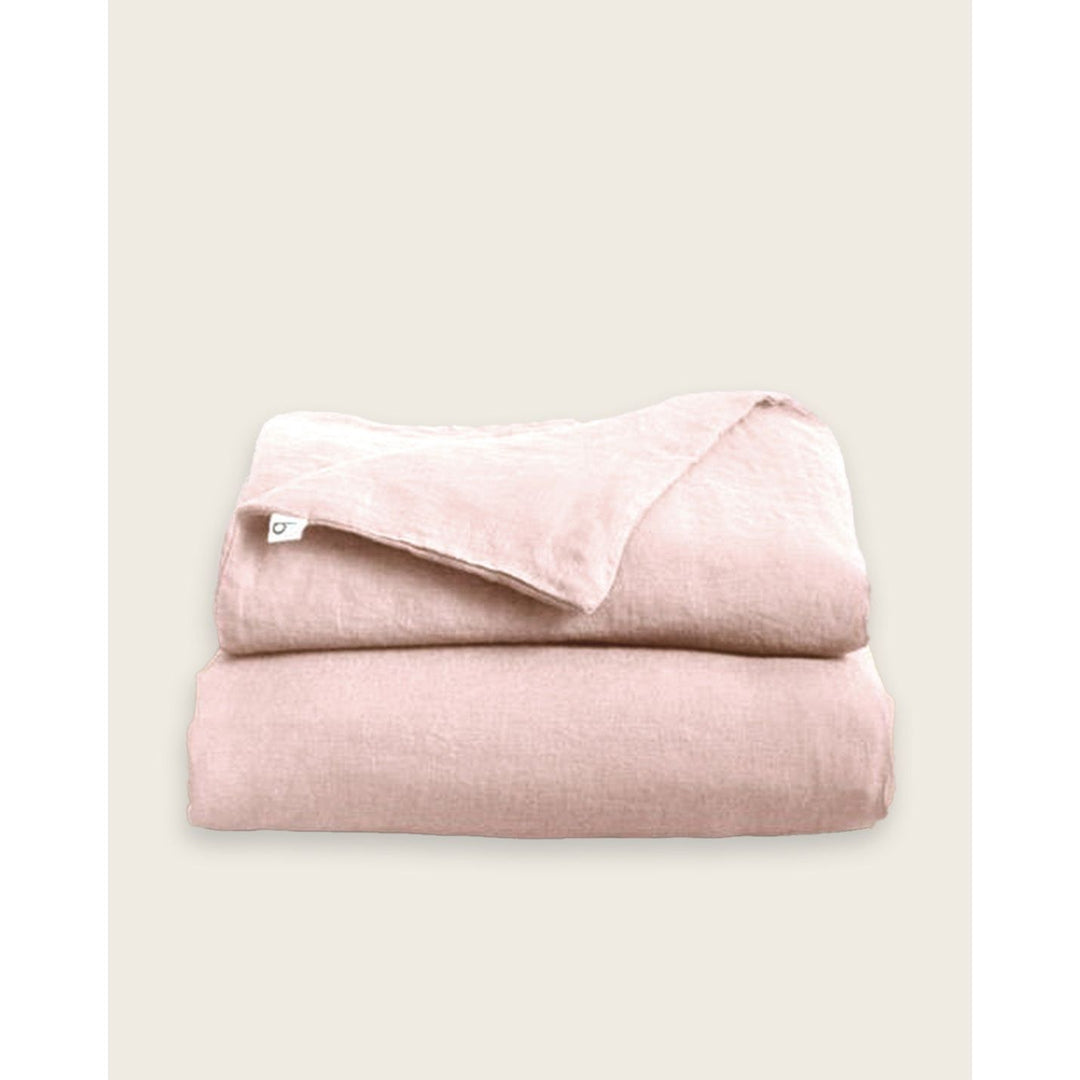 a folded linen duvet cover in pink [32783545696336, 32783545303120]