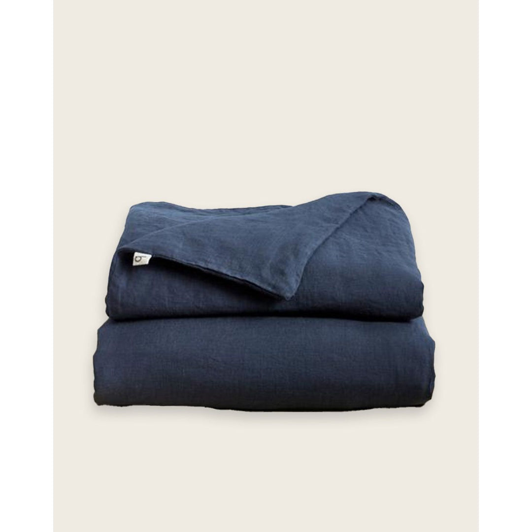 A folded linen duvet cover on a plain background [32783545565264, 32783545172048]