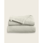 Load image into Gallery viewer, A folded linen duvet cover in oatmeal [32783545729104, 32783545335888, 32783545532496, 32854359507024, 32854401843280]
