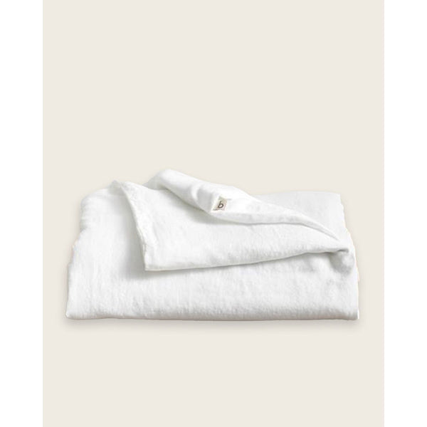A folded linen duvet in white. [32783545630800, 32783545237584, 32783545434192, 32854364618832, 32854406529104]