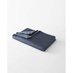 Load image into Gallery viewer, A lap blanket within a luna blue cotton cover, folded. [46288037380315]
