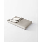 Load image into Gallery viewer, A lap blanket within a silver sage cotton cover, folded. [46288037413083]
