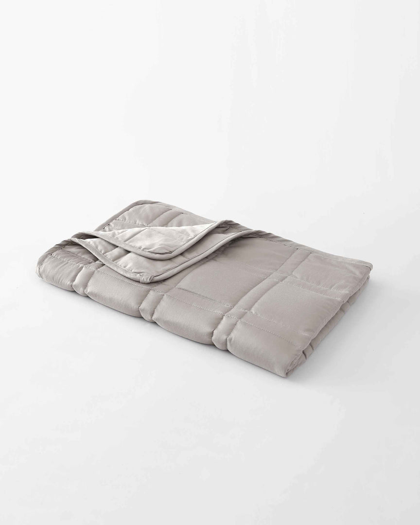 A small folded lap blanket in silver sage on a white background. [43580656746715, 46730821042395, 46730821075163]