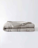 Load image into Gallery viewer, A lap blanket within a silver sage cotton cover, folded. [46288037413083, 46730821107931, 46730821140699]
