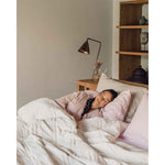 Load image into Gallery viewer, A young woman with a braid sleeps peacefully in a bed with a pink pillowcase and a white weighted blanket across her body.  [42934587818203, 45574417940699,42934587850971, 46452818444507, 42934587883739, 46452819001563]
