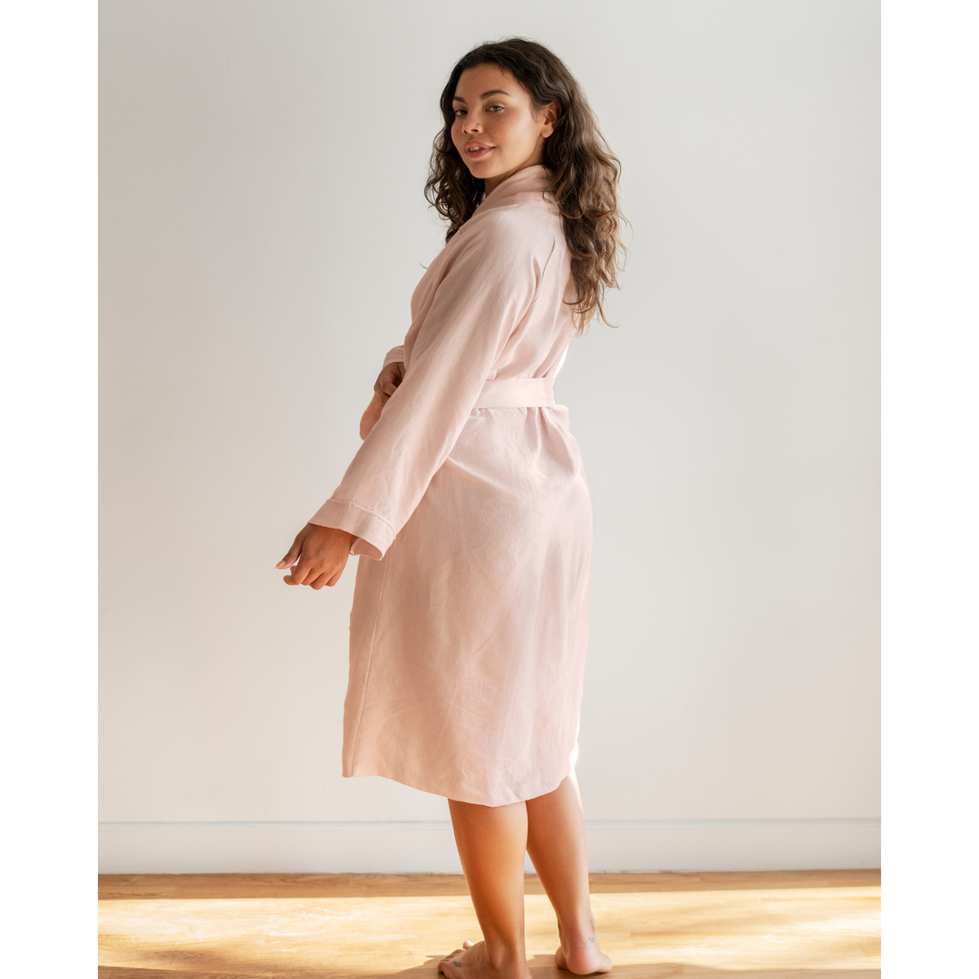 Woman in pink linen robe side [45949488201947, 45949488234715]