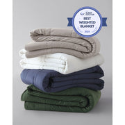 A stack of folded weighted blankets in the colors pebble white, silver sage, and luna blue. [42934587621595, 42934587818203, 42934587883739, 43690188472539, 42934587850971]